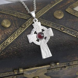 Garnet Pendant, Silver pendant in the shape of celtic cross with Garnet in the centre by iana Jewellery